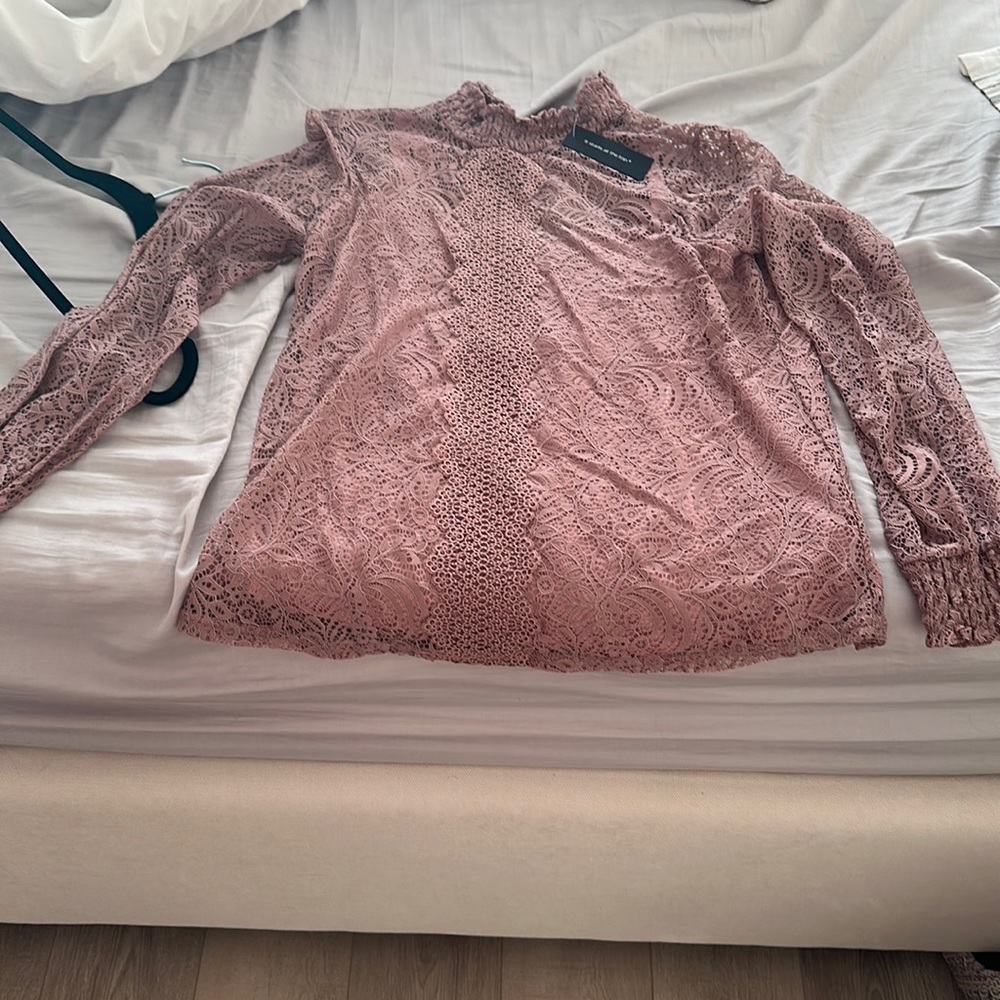 Long sleeve lace top with camisole. Brand new with tags